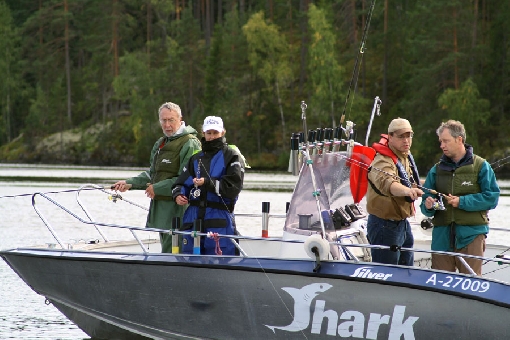A fishing guide advises clients on the right fishing technique.
