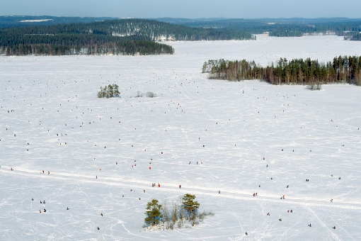 Ice-fishing enthusiasts spread out on the ice like ants during the Lake Kallavesi Finnish Championships.